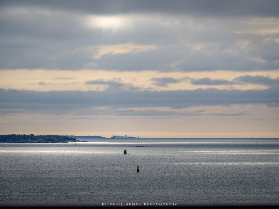 Serene Coastal Horizon Under Dramatic Clouds