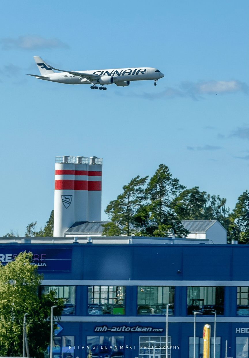 Plane Over Urban&nbsp;Landscape