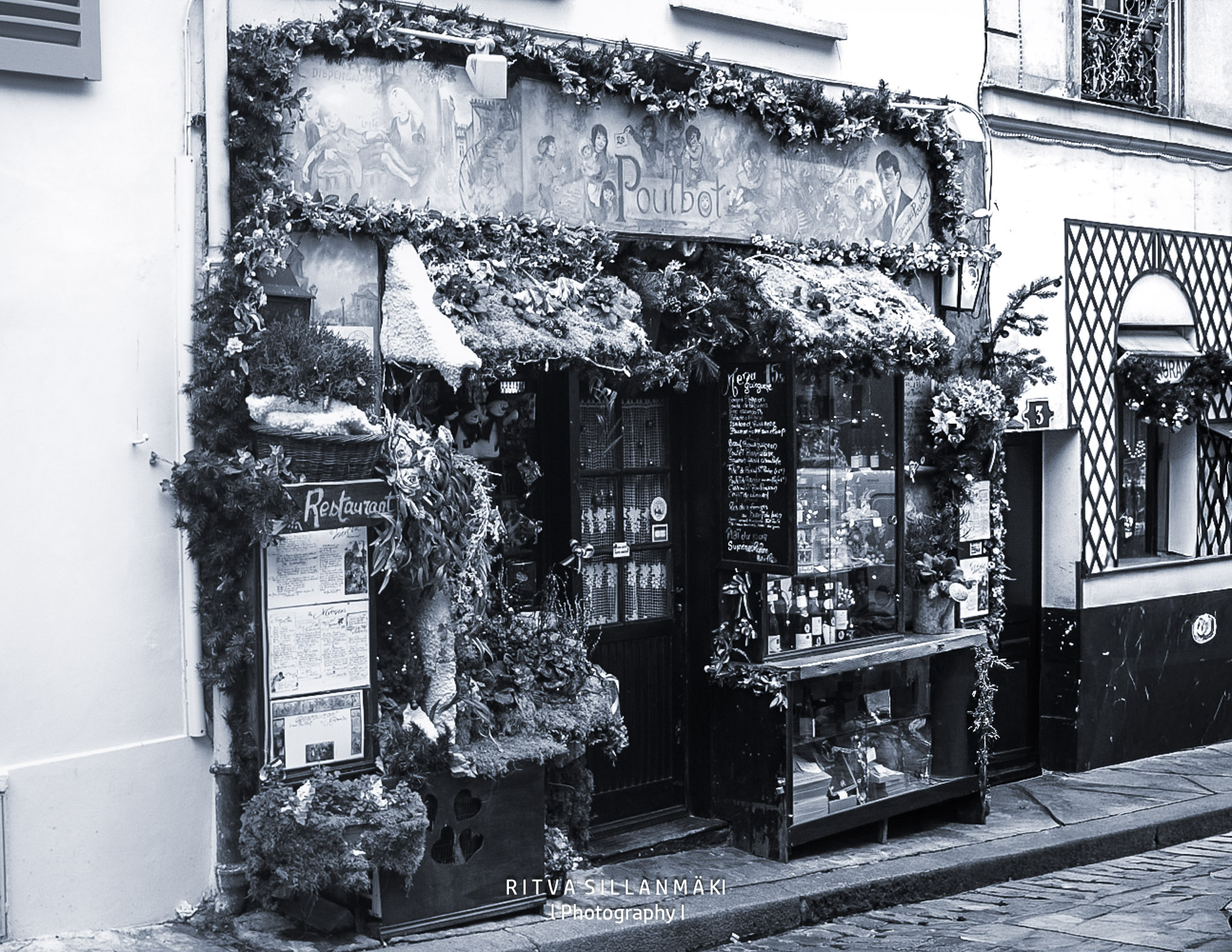 Paul Bot restaurant entrance with floral decor